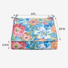 Colorful outdoor seat cushions displayed near the ocean