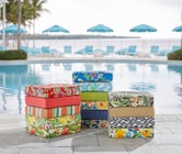 Assorted patterned outdoor seat cushions displayed outdoors